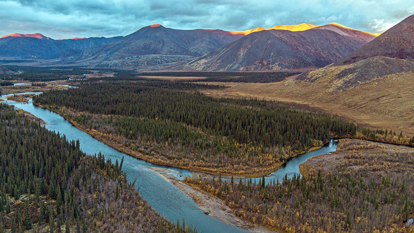 Slow moving river and sunset in Northwest Territories (aerial view)